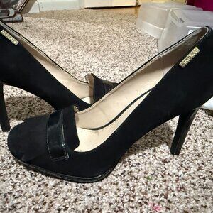 Women’s high-heeled pump, specifically a platform pump by Calvin Klein